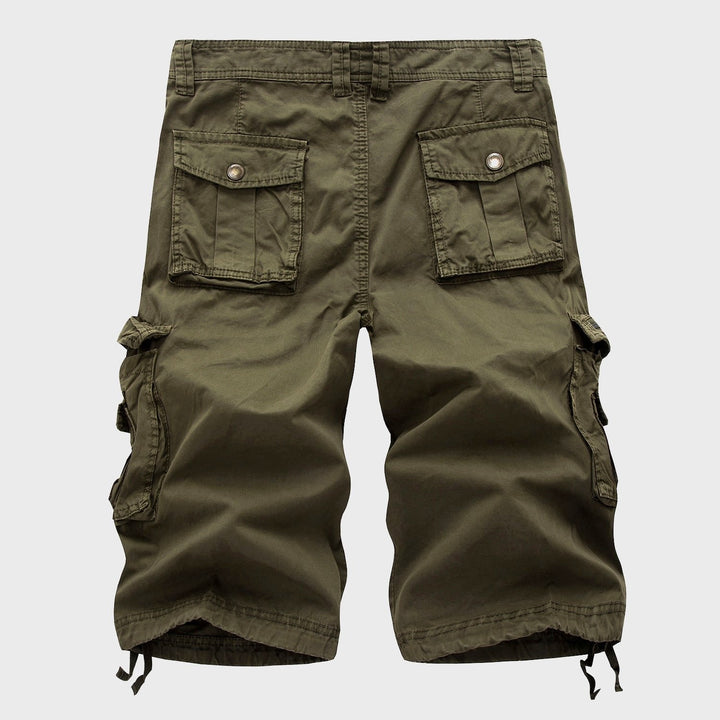 Men's Cole knee-length olive green cargo shorts with multi-pocket design and adjustable drawstring hems.
