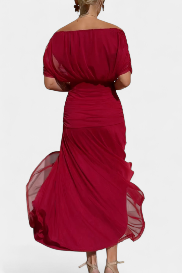 Women's floral off-shoulder maxi dress with a ruched waist, flowing skirt, and vibrant print.