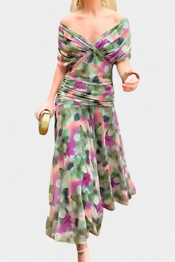 Women's floral off-shoulder maxi dress with ruched waist and flowing skirt.