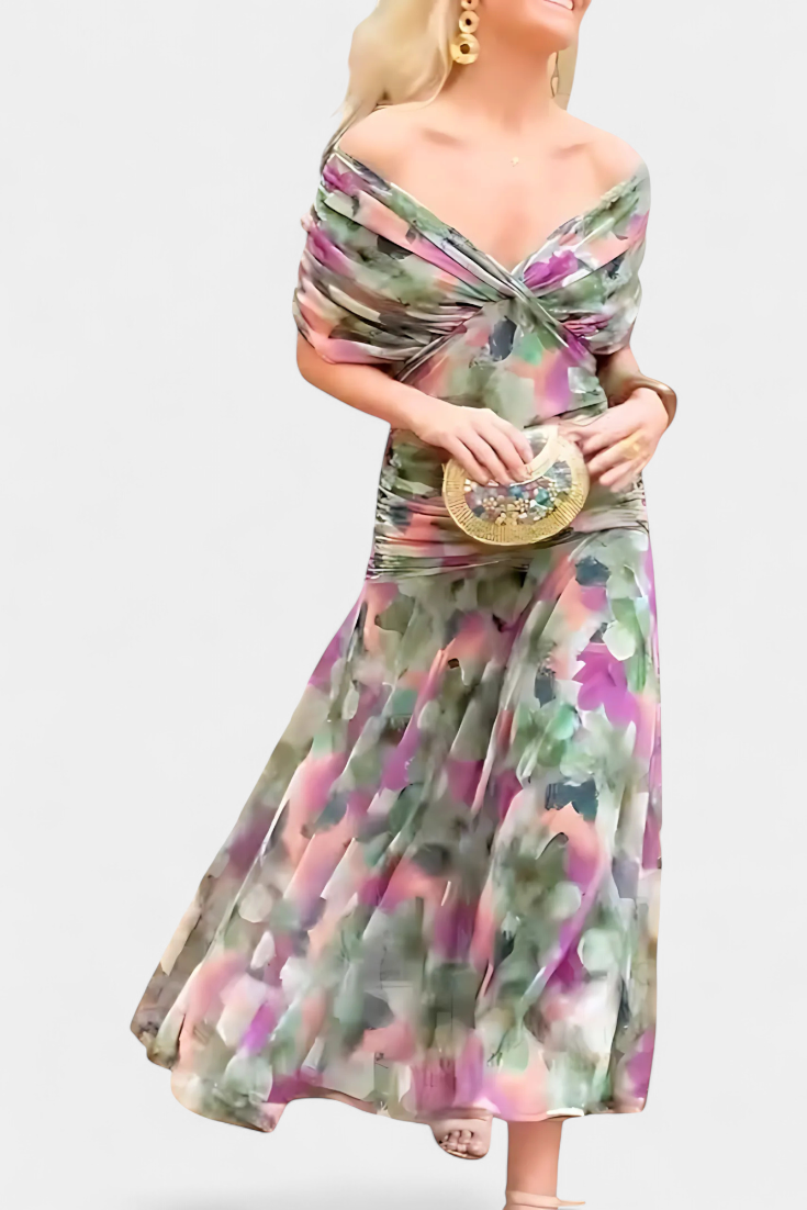 Women's off-shoulder floral maxi dress with a ruched waist, flowing skirt, and vibrant print.