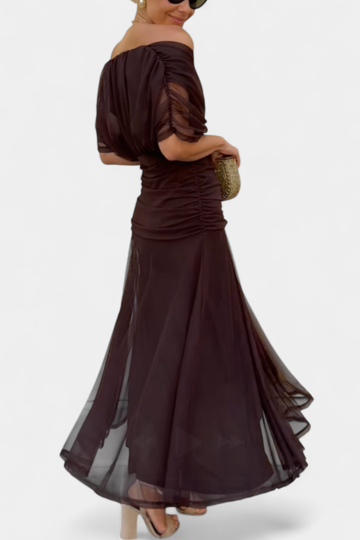 Women's floral off-shoulder maxi dress with a ruched waist, flowing skirt, and vibrant print.