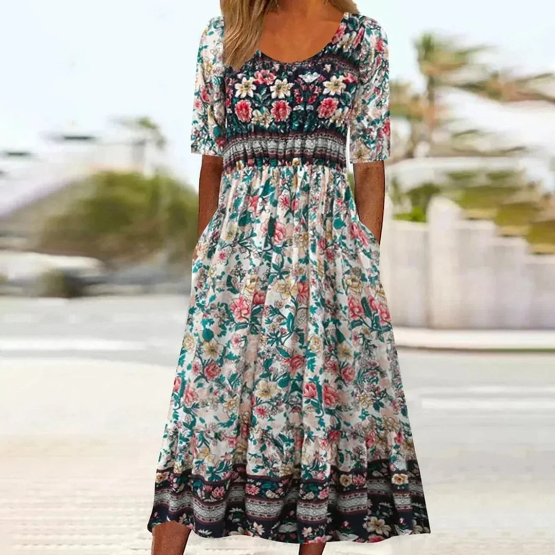 Women's Dahlia square neck boho printed midi dress with shirred bodice and tiered skirt.