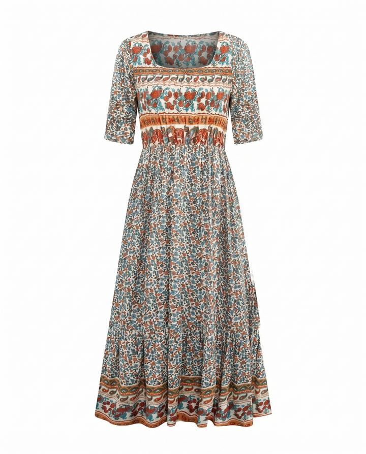 Boho printed midi dress with square neck, shirred bodice, tiered skirt, and short sleeves.