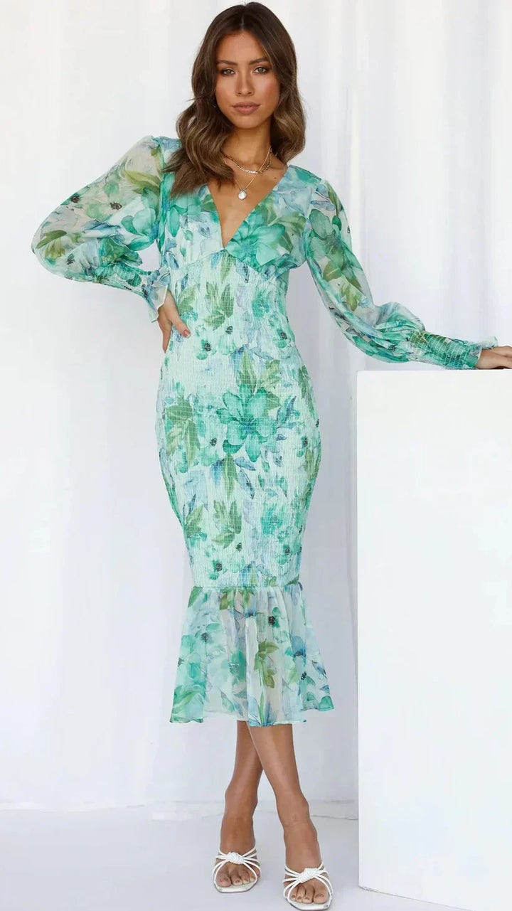 Women's Davina floral smocked V-neck midi dress with sheer long sleeves and ruffle hem.