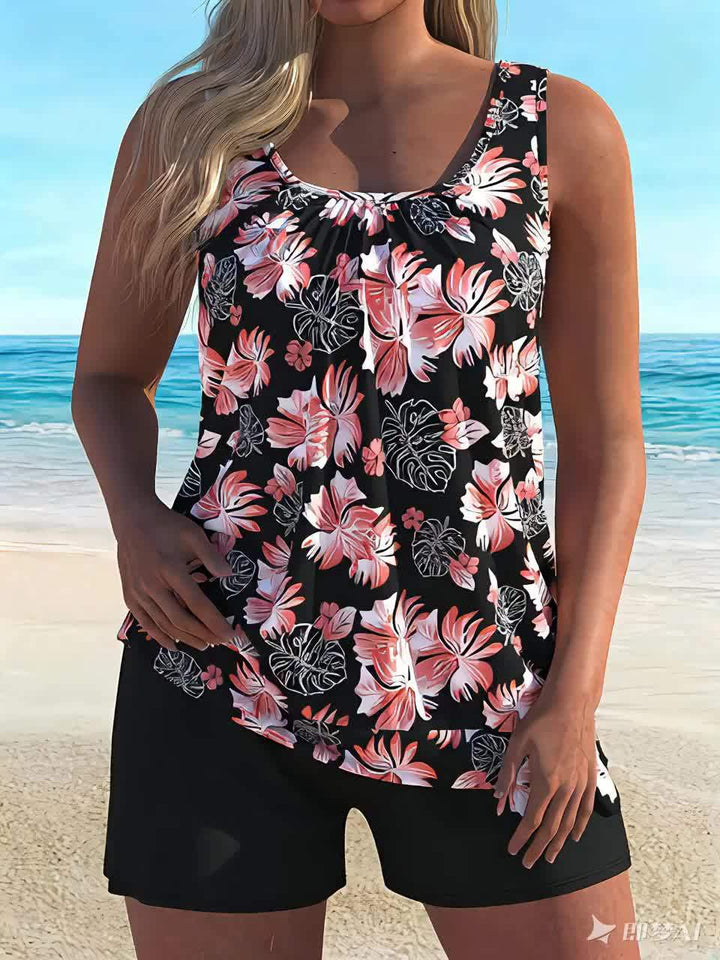 Women's floral tankini with shorts, featuring a blue and white botanical print.