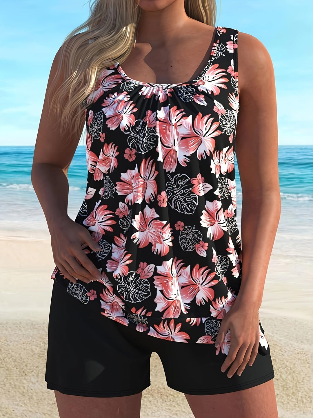 Women's floral tankini with navy blue shorts.