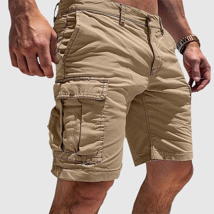 Men's knee-length George cargo shorts in a versatile solid tan, featuring practical side flap pockets and belt loops.