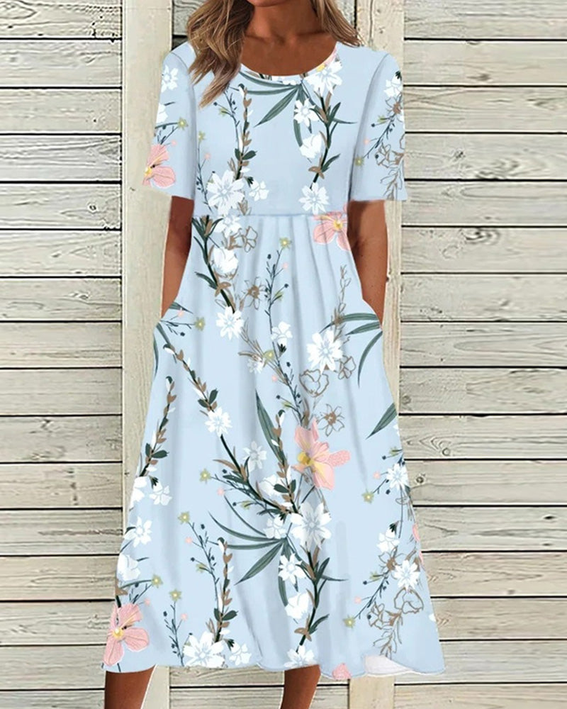 Light blue floral printed midi dress with short sleeves, round neckline, and side pockets.