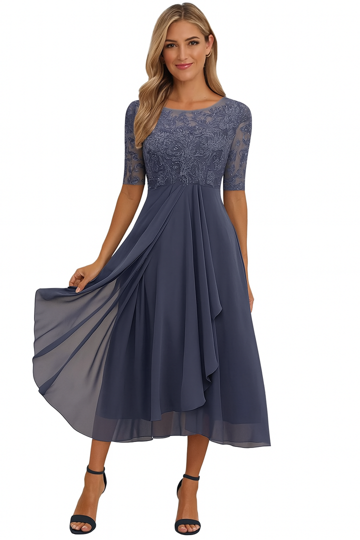 Women's Greta lace A-line midi dress in dark blue with sheer half sleeves and flowing skirt.