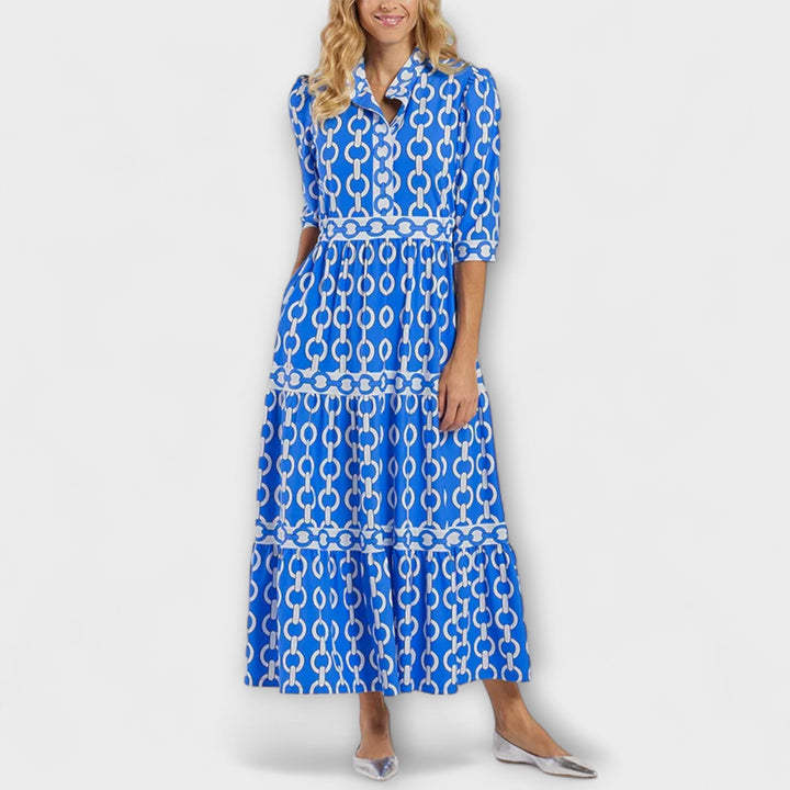 Women's Gwen chain print collared midi dress in black and gold, with long sleeves and a flowing skirt.