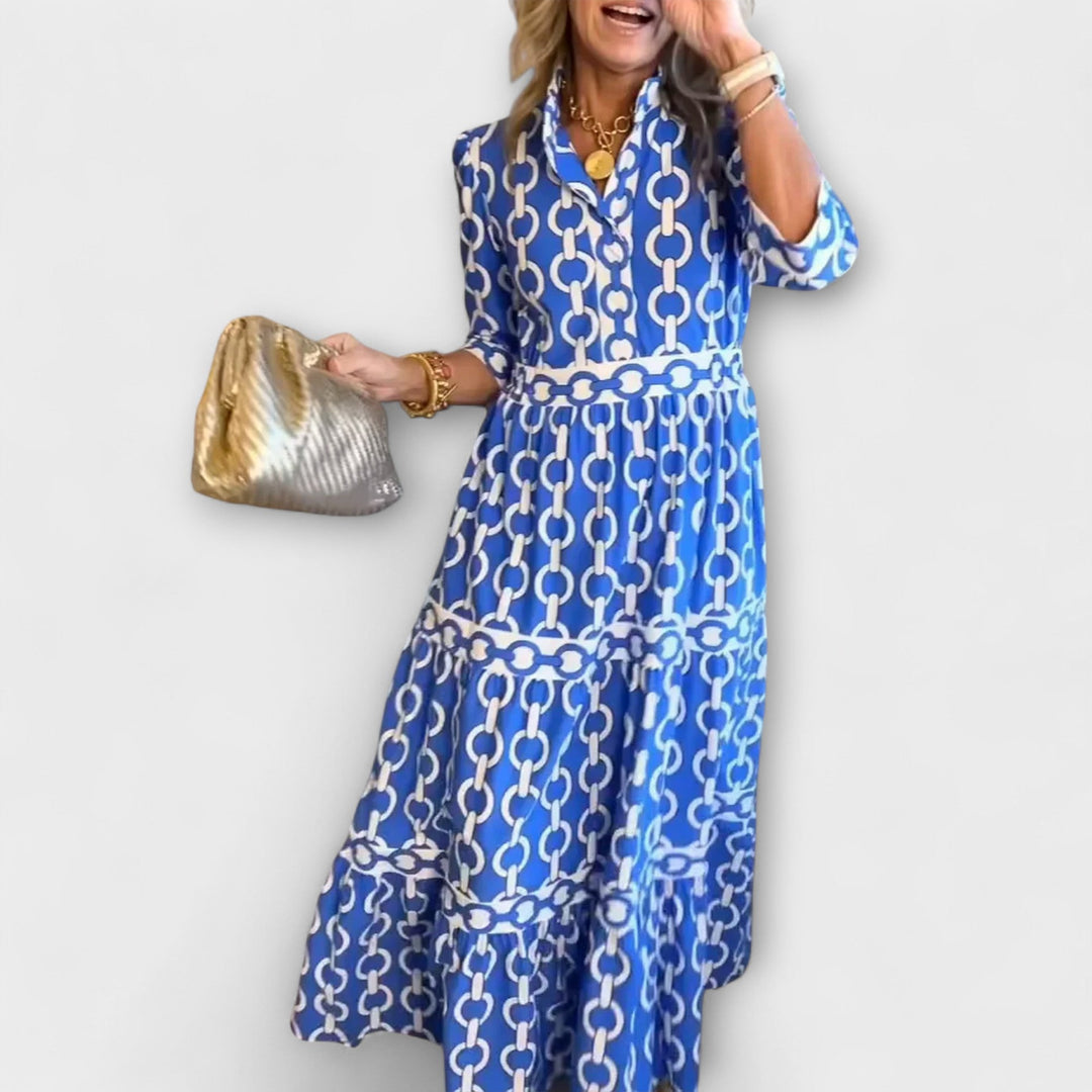 Blue women's chain print collared midi dress with long sleeves.