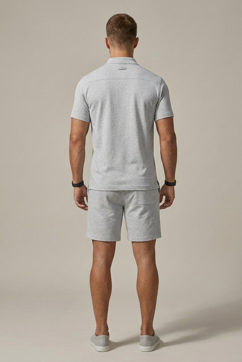 Men's Hugo light grey marl polo shirt and drawstring shorts set, shown from the back.