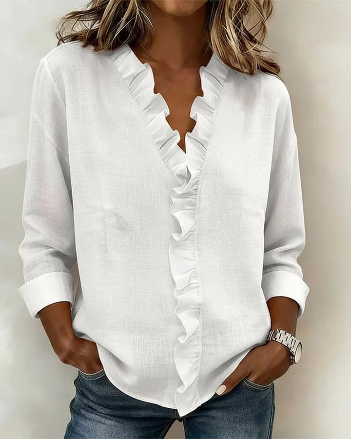 White V-neck ruffle blouse with long sleeves for women.