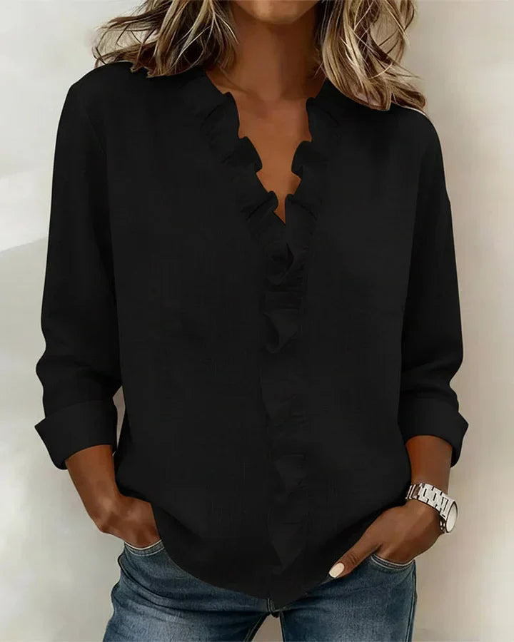 Black women's V-neck ruffle blouse with long sleeves, made from a lightweight fabric.