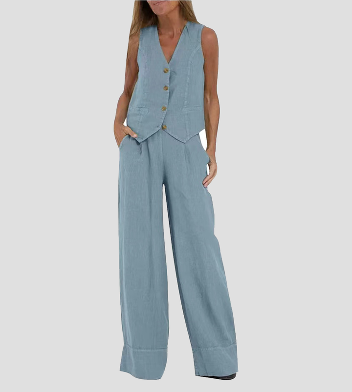 Women's Jhoana light blue linen vest and wide-leg pants set with brown buttons.