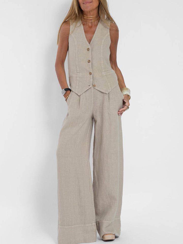 Woman modeling a Jhoana beige linen vest and wide-leg pants set.