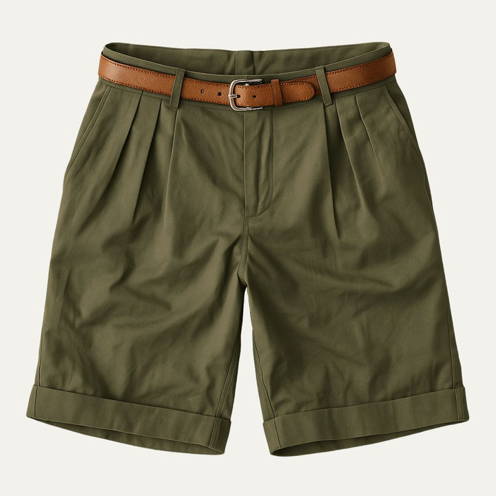 Men's Julian olive green pleated chino shorts with a brown leather belt and cuffed hems.