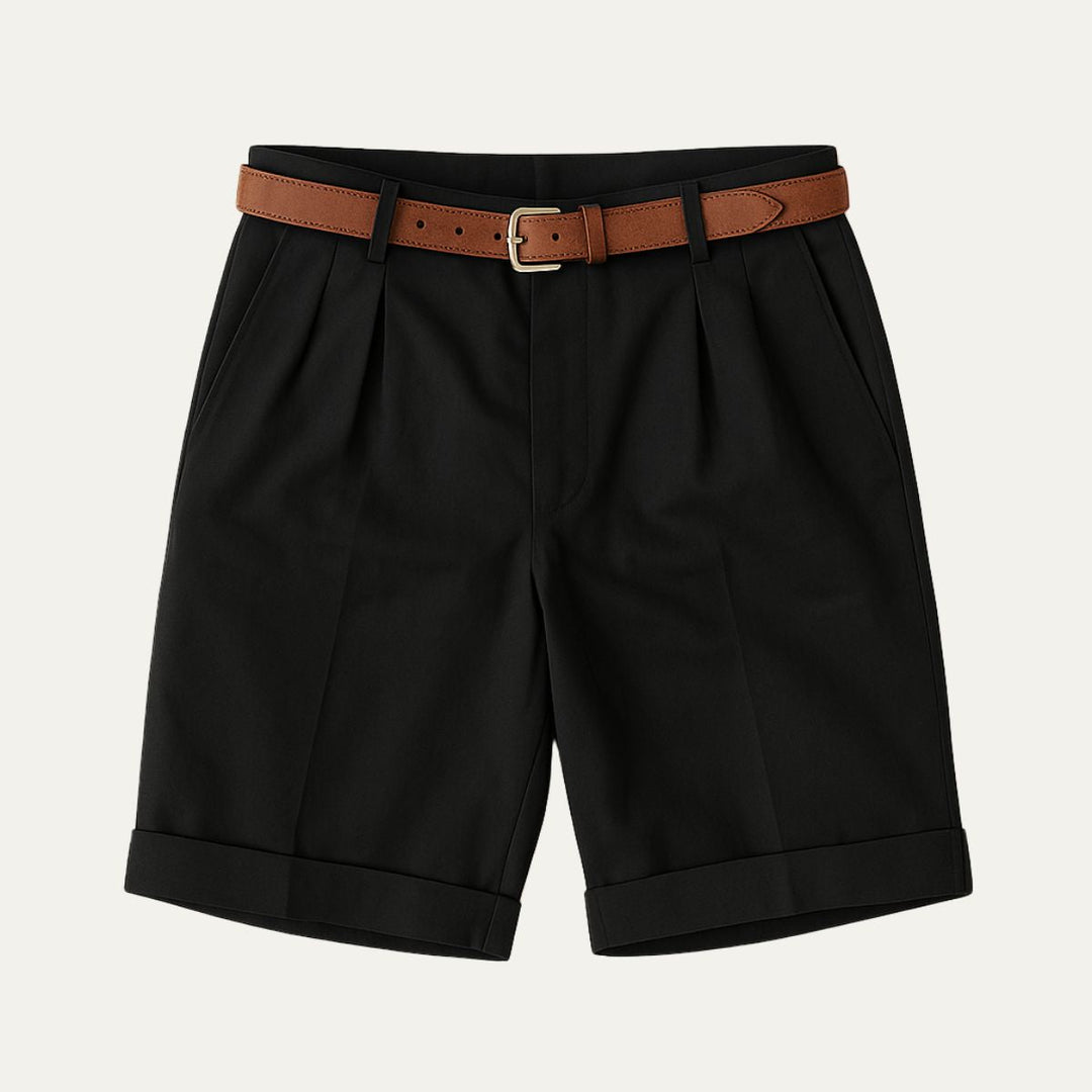 Men's Julian black pleated chino shorts with a brown leather belt and cuffed hems.