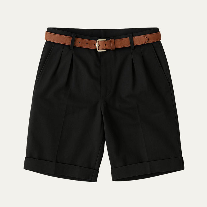 Men's Julian black pleated chino shorts with a brown leather belt and cuffed hems.