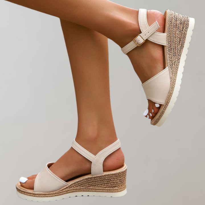 Kaiya women's beige orthopedic wedge sandals with wide front strap, adjustable ankle strap, and woven-style sole.