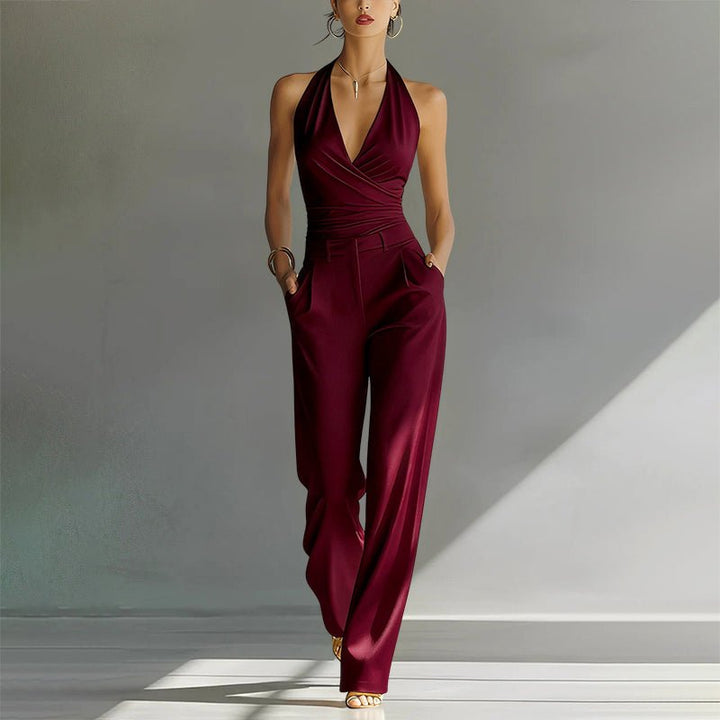 Women's Karen halter wide leg jumpsuit in solid burgundy with a wrap-style bodice and side pockets.