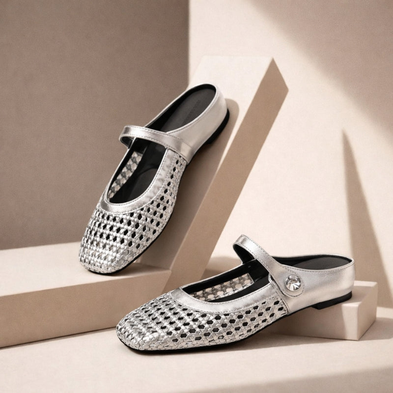 Silver orthopedic woven mule flats with Mary Jane strap.