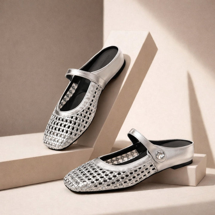 Silver orthopedic woven mule flats with Mary Jane strap.