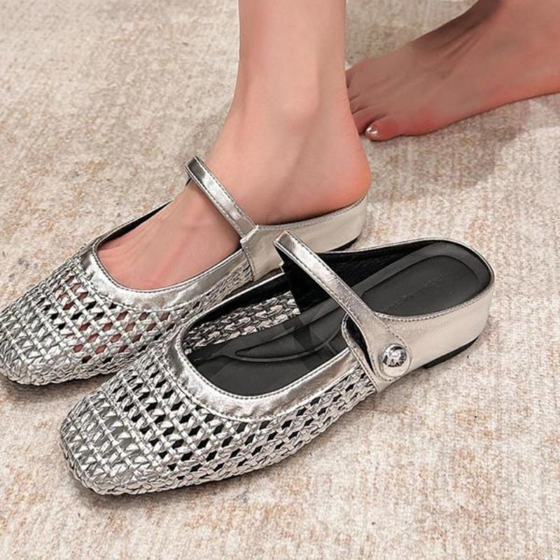 Beige woven orthopedic mule flats with a Mary Jane strap.
