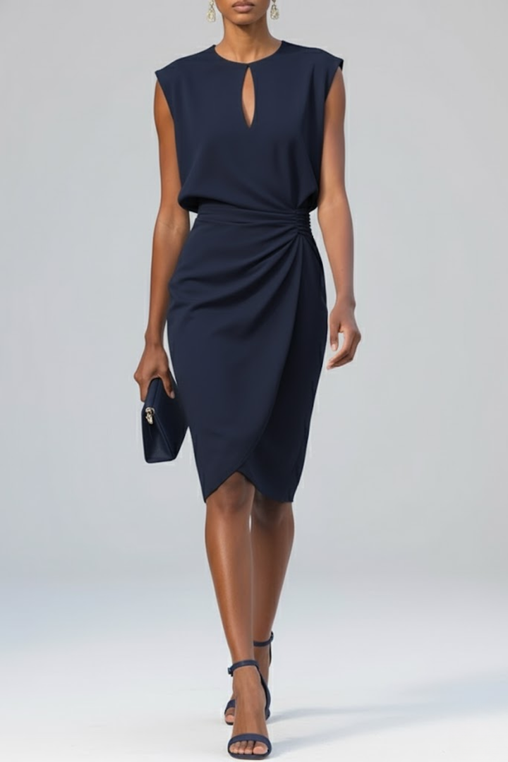 Navy Katharina keyhole ruched midi dress with sleeveless design, worn with matching clutch and sandals.