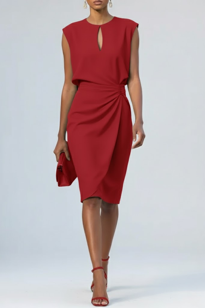 Women's red keyhole ruched midi dress with sleeveless design, holding a matching clutch.