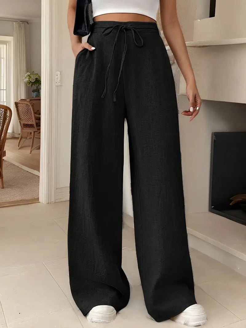 Black Keira women's linen wide-leg pants with drawstring waist and side pockets.