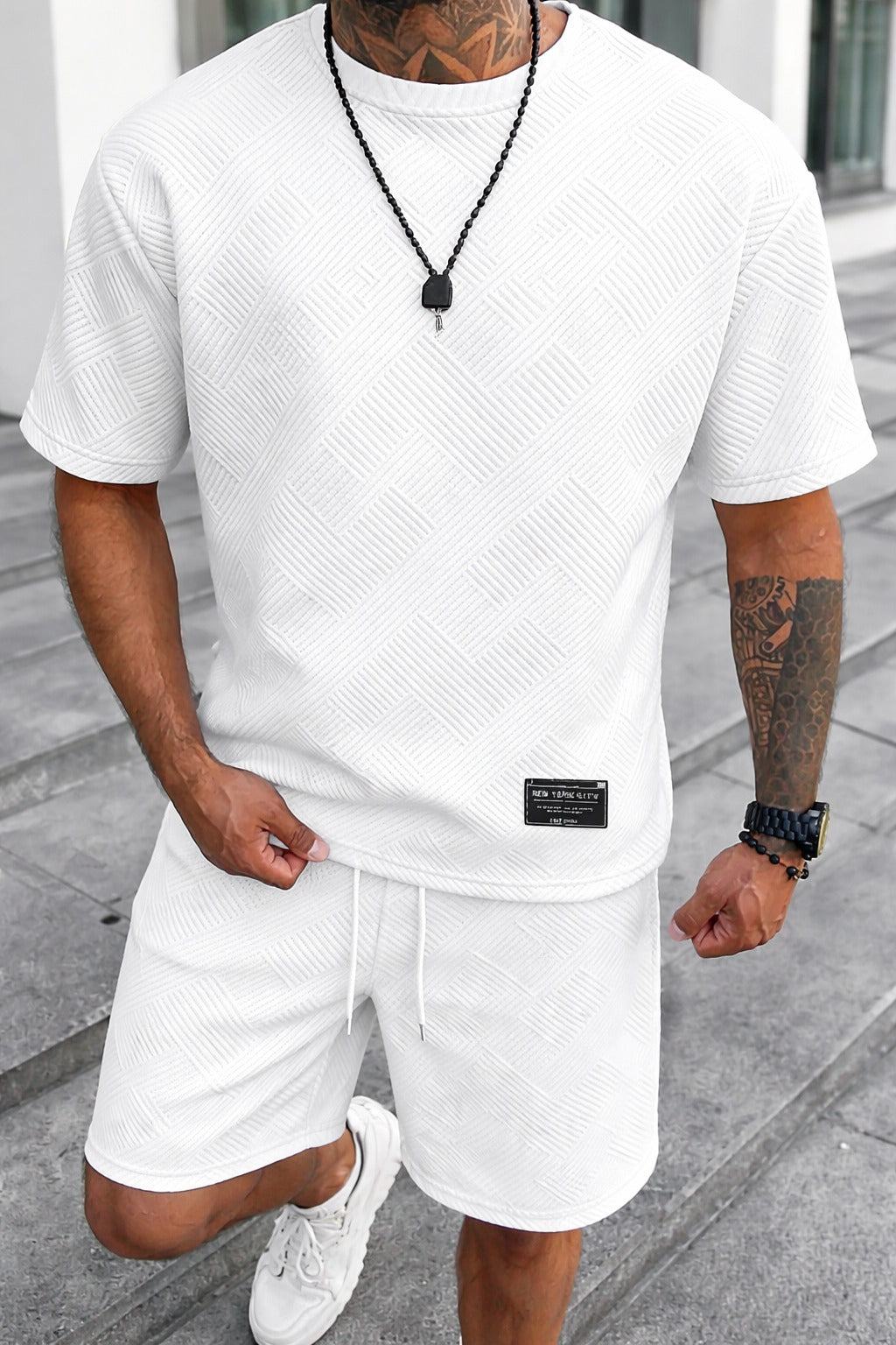 Men's Landon white textured t-shirt and drawstring shorts set with subtle tonal pattern.