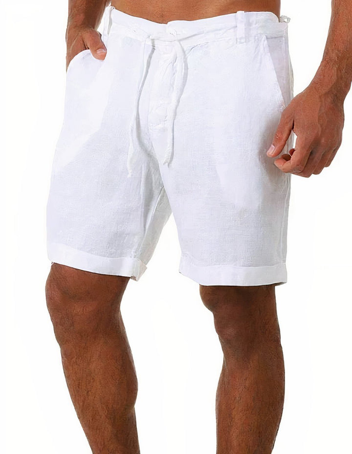 Men's white linen drawstring shorts with belt loops, side pockets, and rolled cuffs.