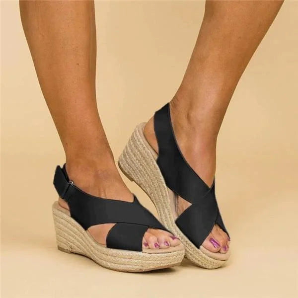Brown leather orthopedic wedge sandals with cushioned footbed and adjustable strap.