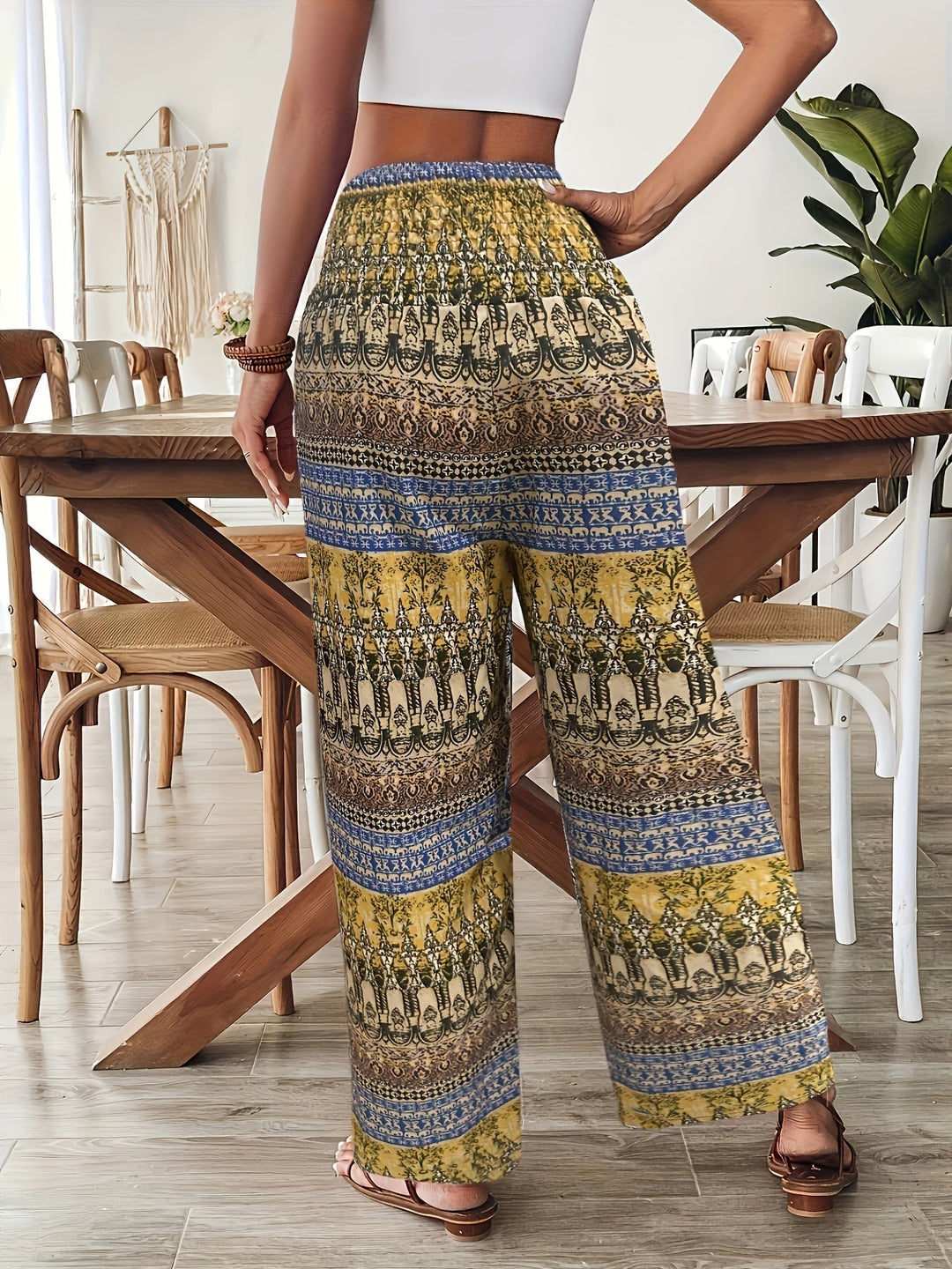 Women's Lyra boho print wide leg pants with a colorful pattern, drawstring waist, and flowing fit.