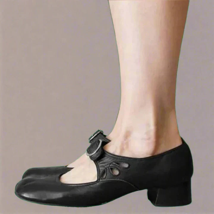 Women's black leather orthopedic wedge sandals with buckle strap.