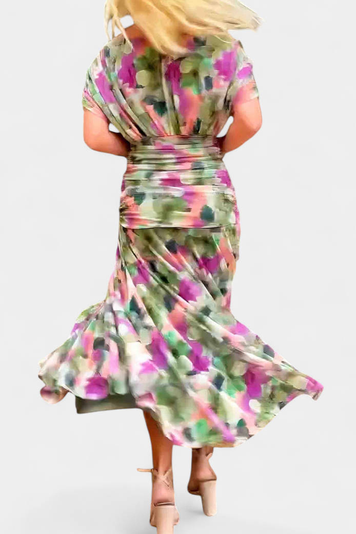 Black off-shoulder ruched maxi dress with sheer long sleeves, elegant and flowing.