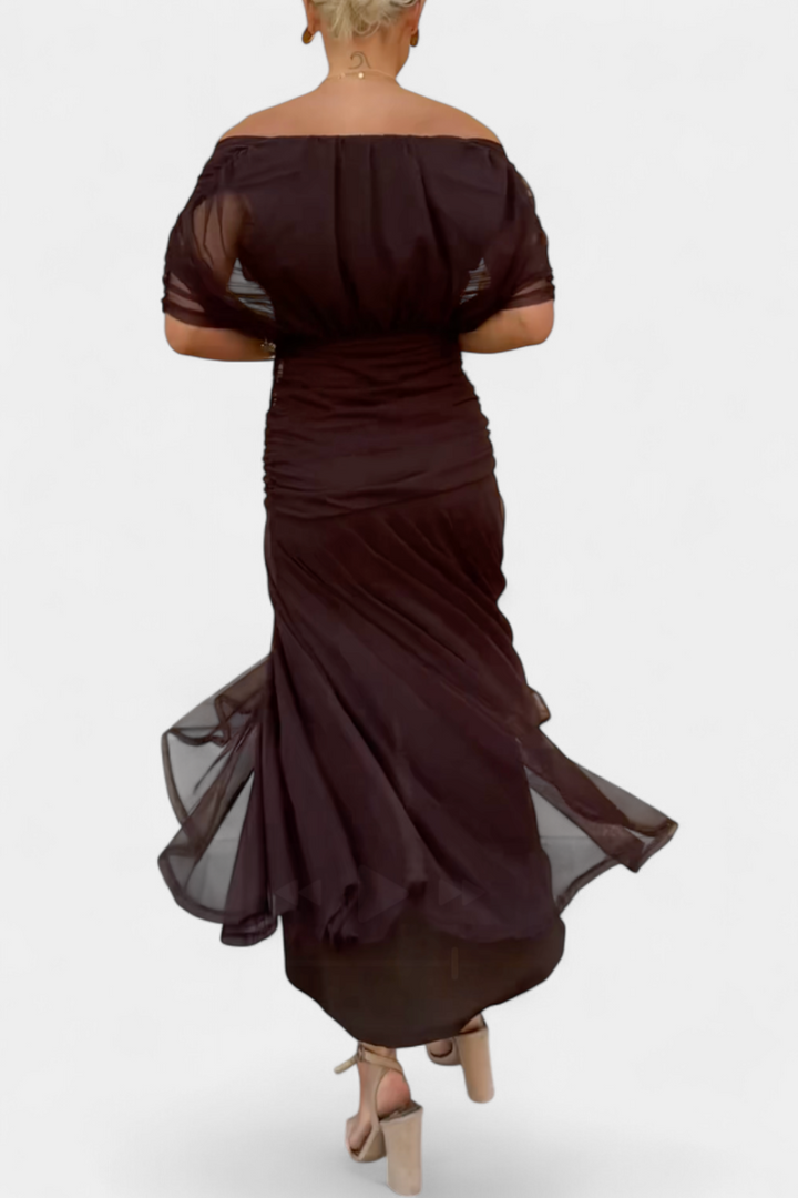 Black off-shoulder ruched maxi dress with sheer long sleeves, elegant and flowing.