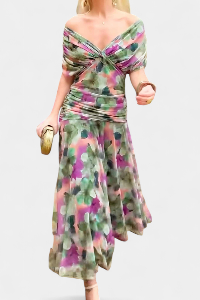 Black off-shoulder ruched maxi dress with sheer long sleeves and a flowing skirt.
