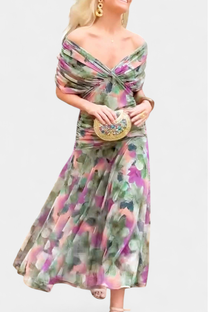 Black off-shoulder ruched maxi dress with sheer long sleeves and a flowing skirt.