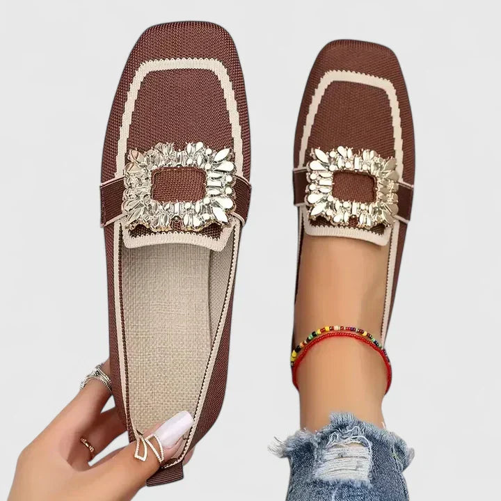 Brown Maylora women's orthopedic loafers with a prominent gold statement buckle, soft leather, and comfortable sole.