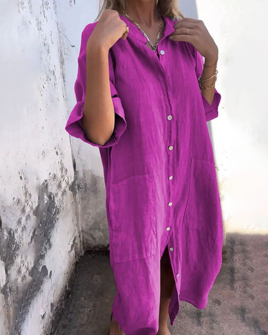 Mina women's plus size magenta shirt dress with rolled sleeves, button-front, and front pockets.
