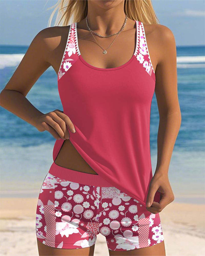 Women's Mirelle tankini with shorts, black top, and floral print bottoms.