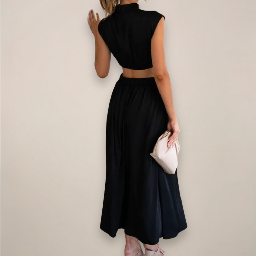 Women's black cutout waist maxi dress with cap sleeves.