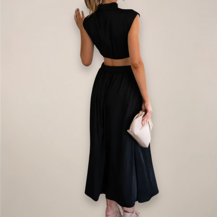 Women's black cutout waist maxi dress with cap sleeves.