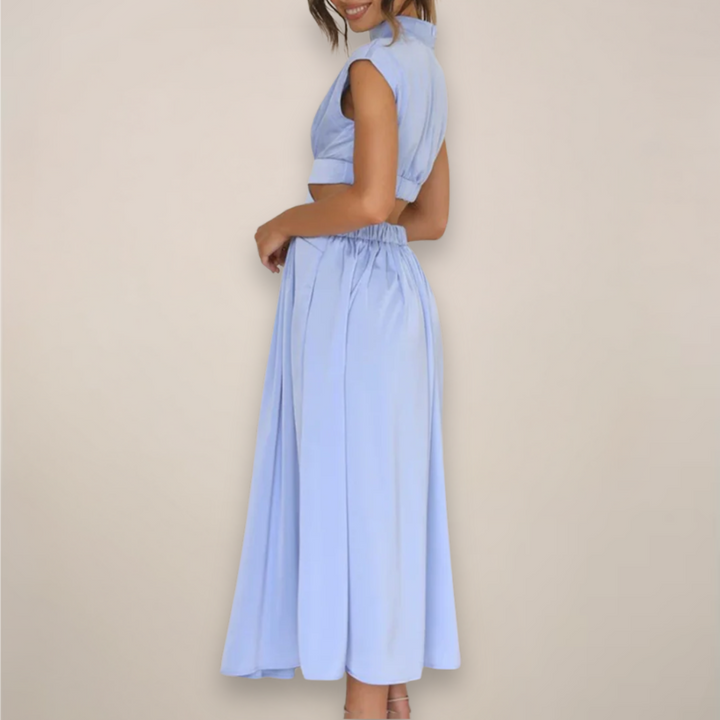 Women's black cutout waist maxi dress with cap sleeves.