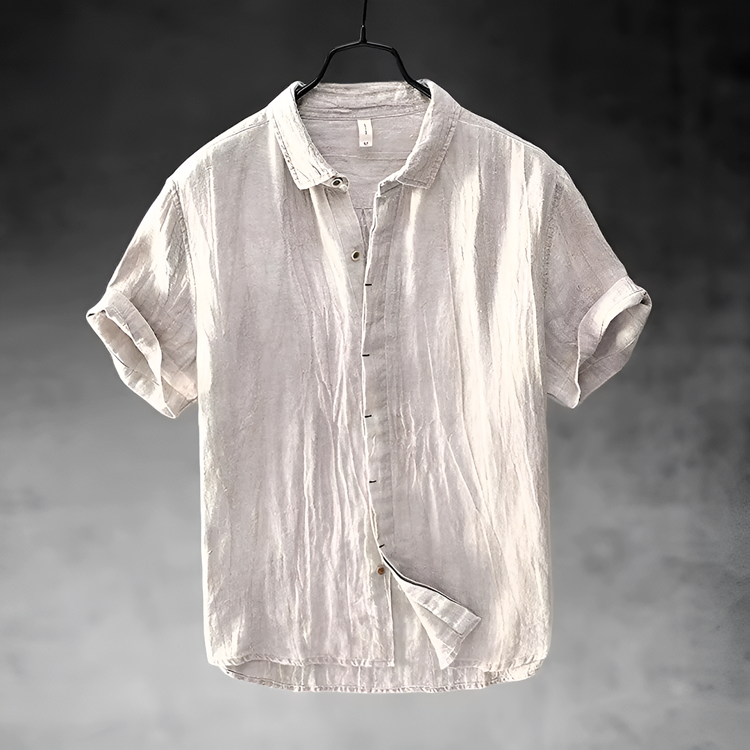 Paulino men's light gray short sleeve button-up shirt with a textured appearance, hanging.