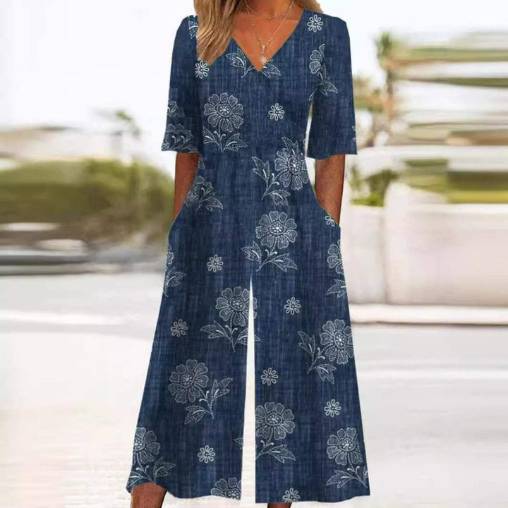 Scarlett women's blue boho floral V-neck wide-leg jumpsuit with half sleeves and pockets.