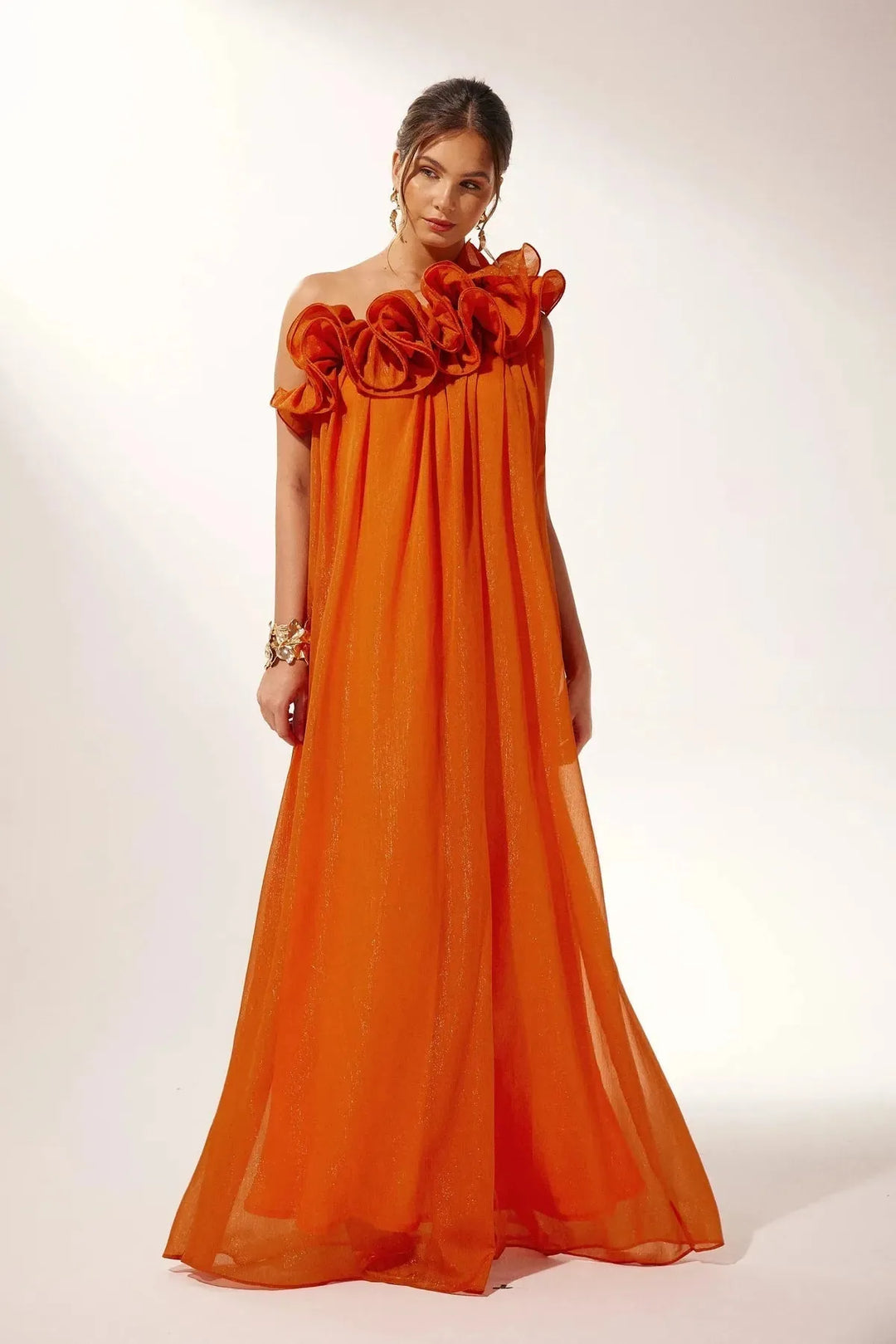 White one-shoulder ruffle maxi dress for women, flowing fabric.