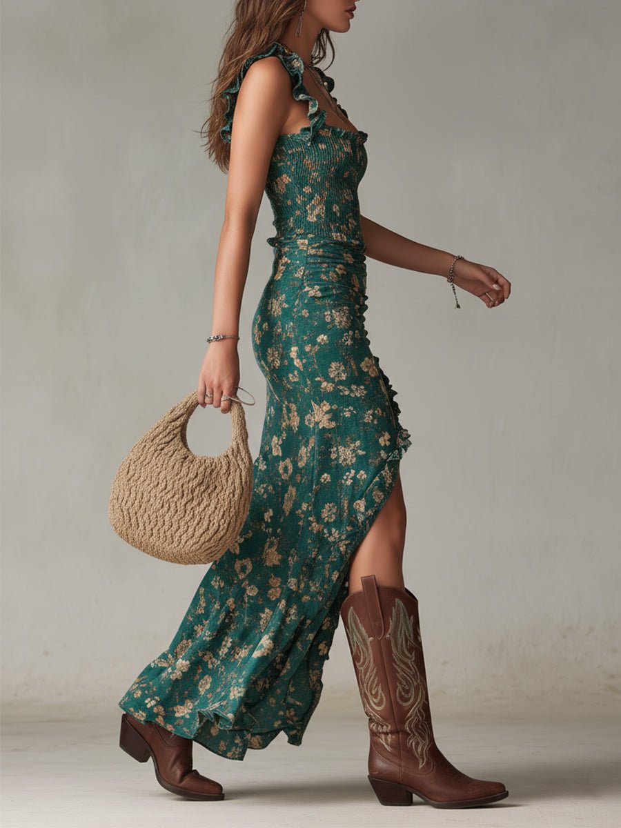 Woman in a green floral smocked ruffle maxi boho dress with a front slit, brown western boots, and a woven bag.